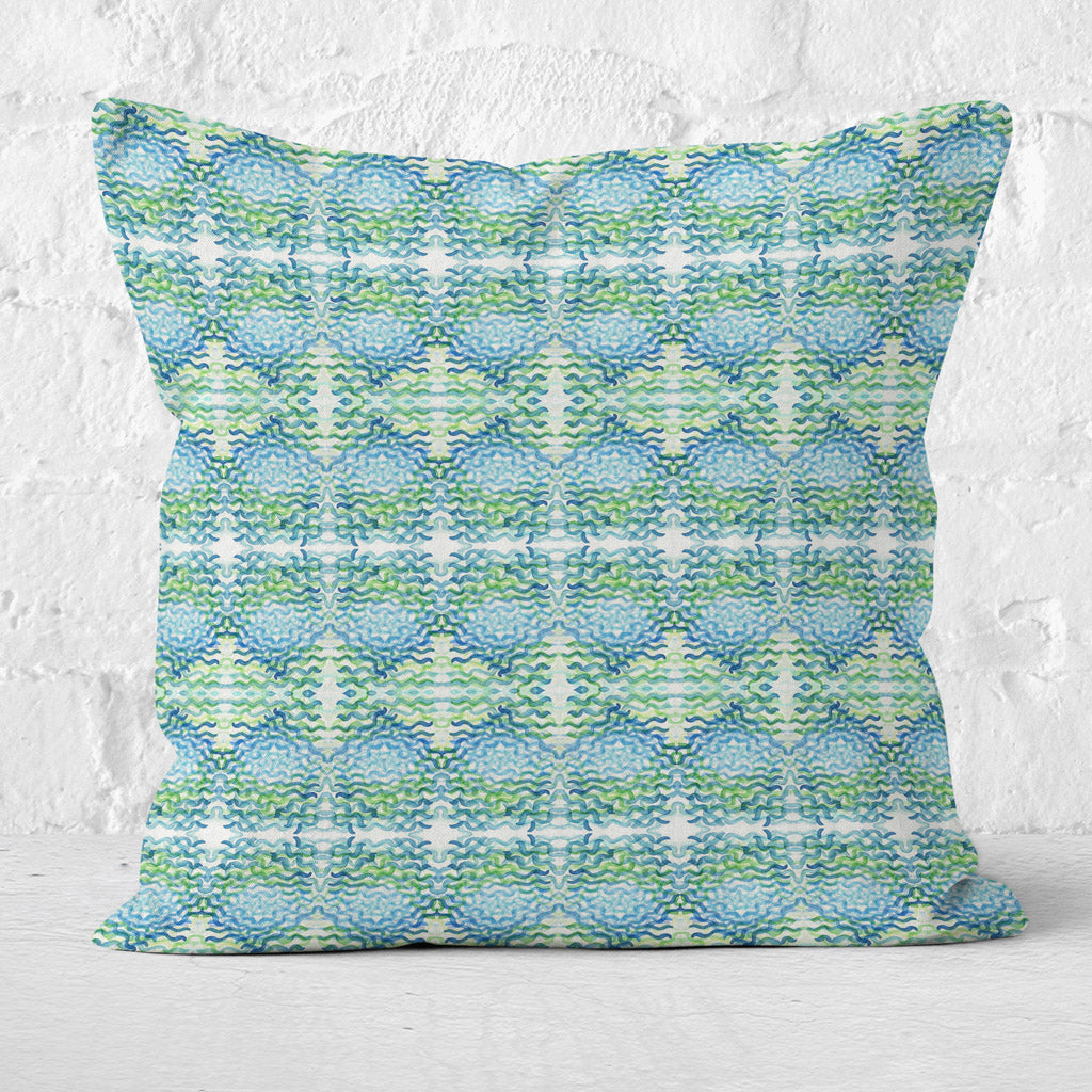 Square throw pillow featuring a hand-painted abstract pattern in bright green.