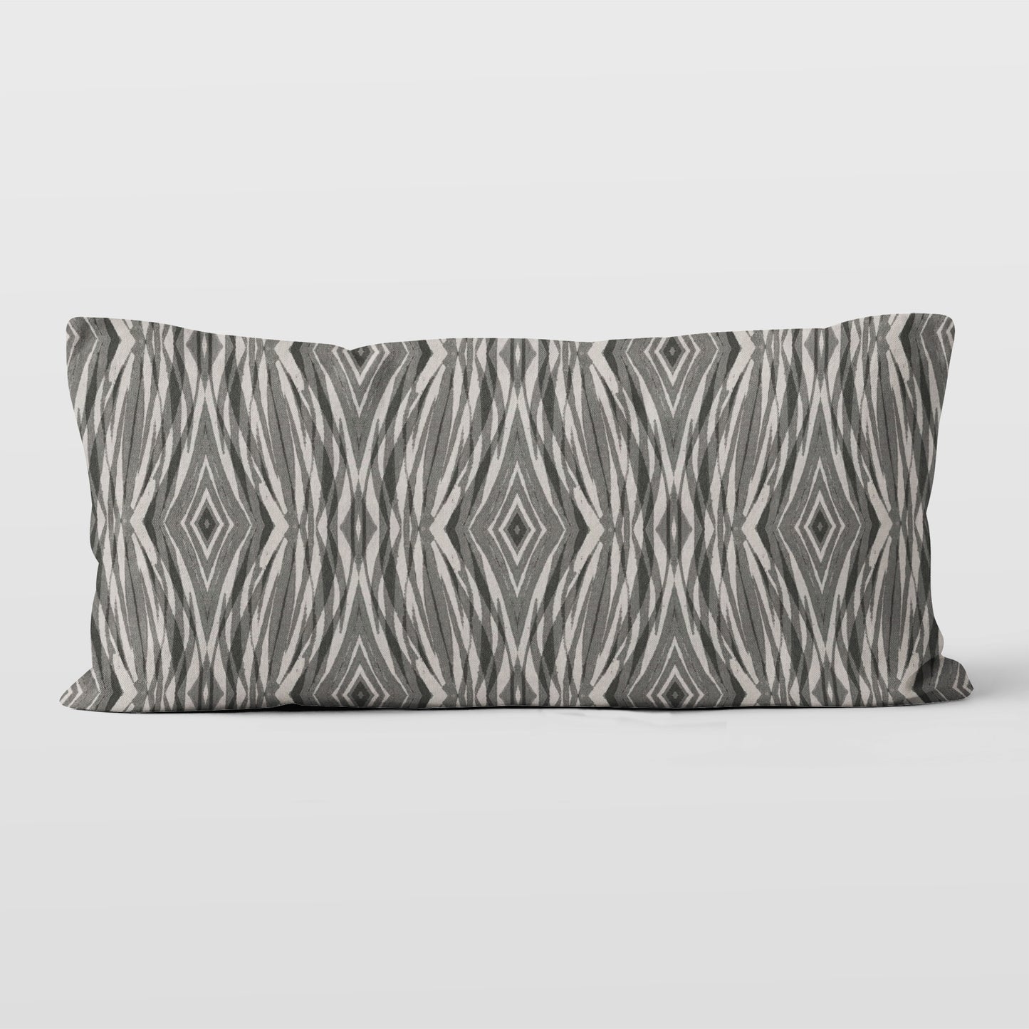 Rectangular lumbar pillow featuring linocut pattern in grey and neutral tones.