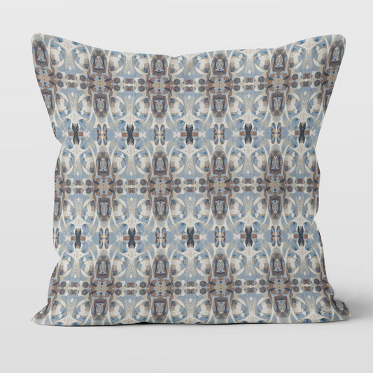 Square throw pillow featuring a blue and brown abstract painted pattern