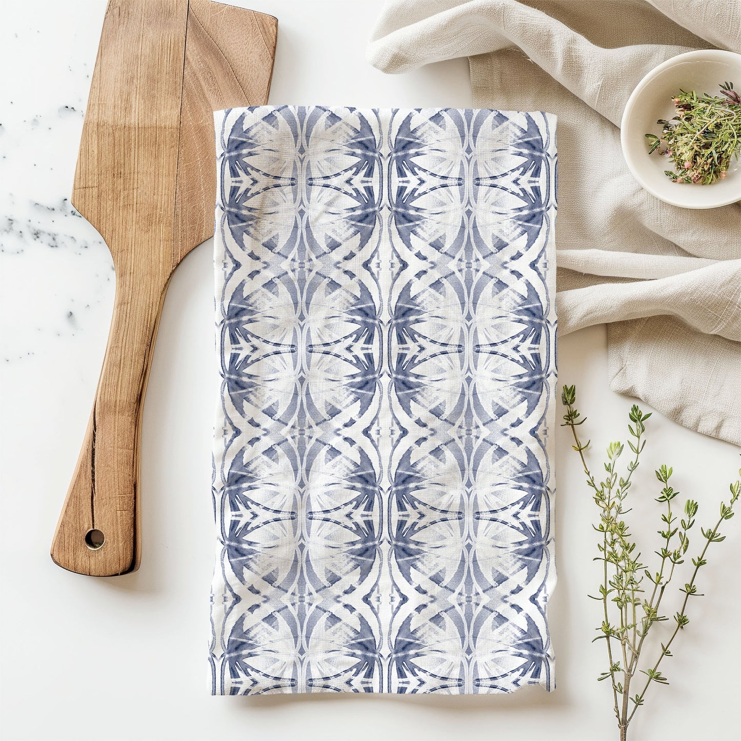 Flour sack tea towel featuring a light blue abstract pattern