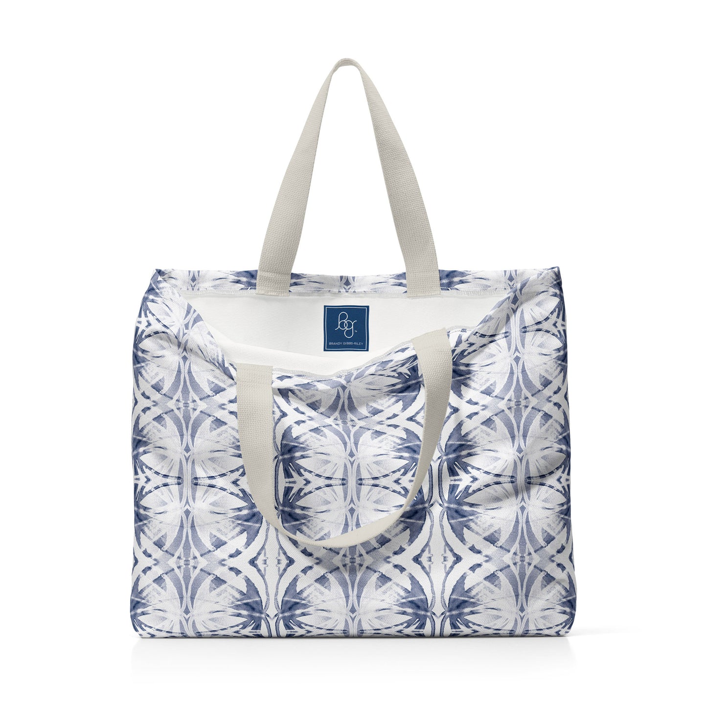 Oversized tote bag featuring a blue and white abstract pattern and interior blue label