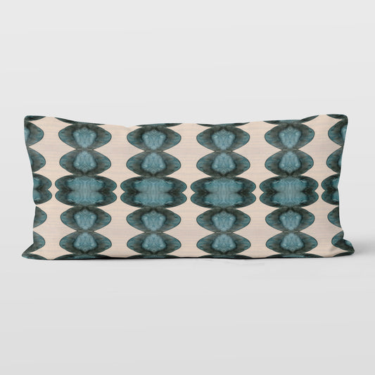 Rectangular lumbar pillow featuring abstract hand-painted pattern in blue, black, and cream.