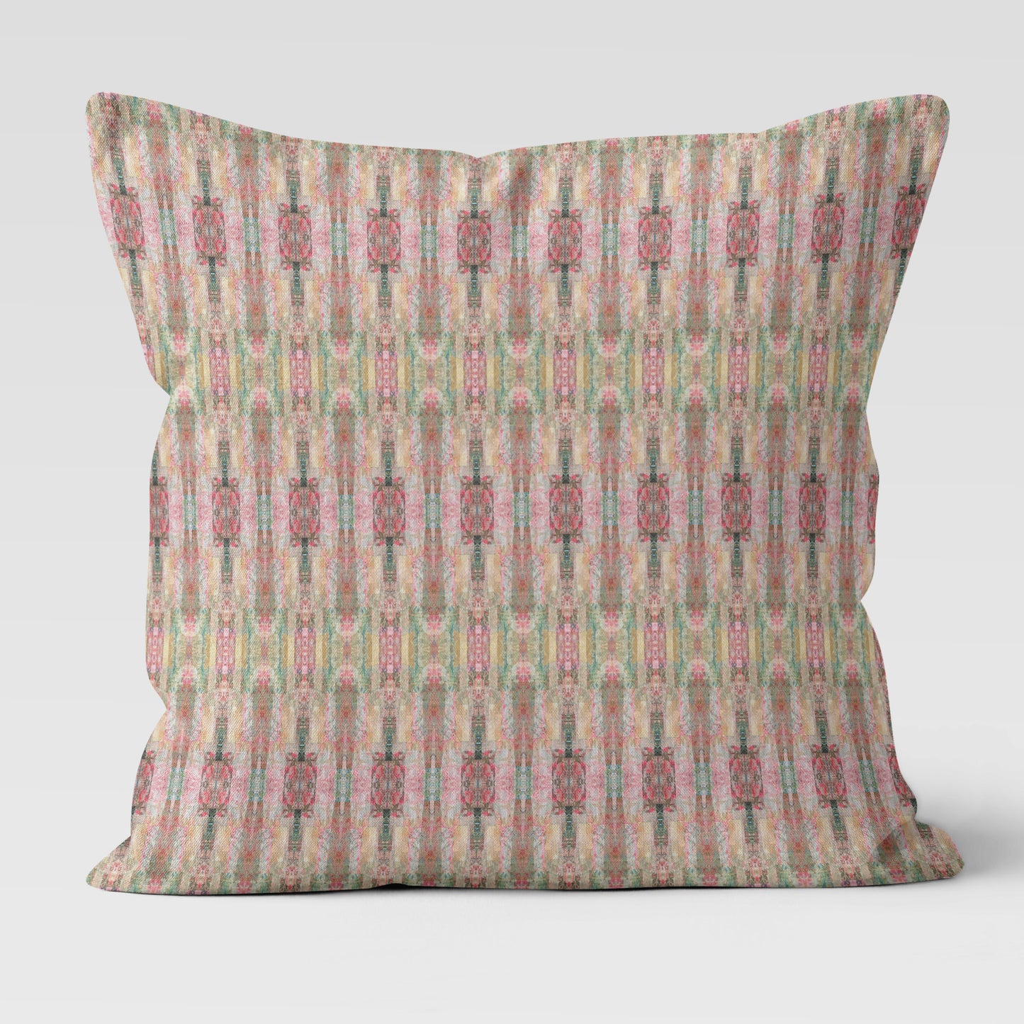 Throw pillow with abstract pink pattern on a white background.