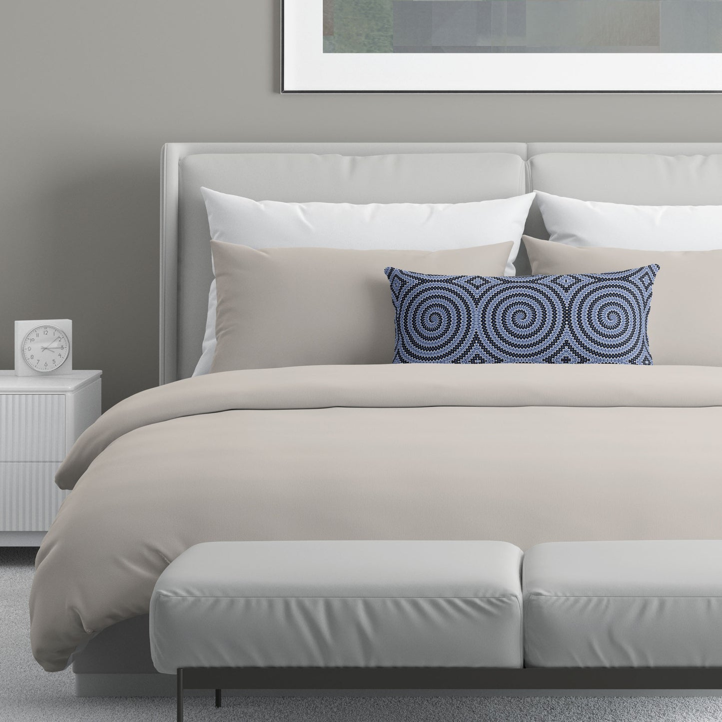 Neutral colored bedroom featuring a bed with an abstract patterned lumbar pillow.