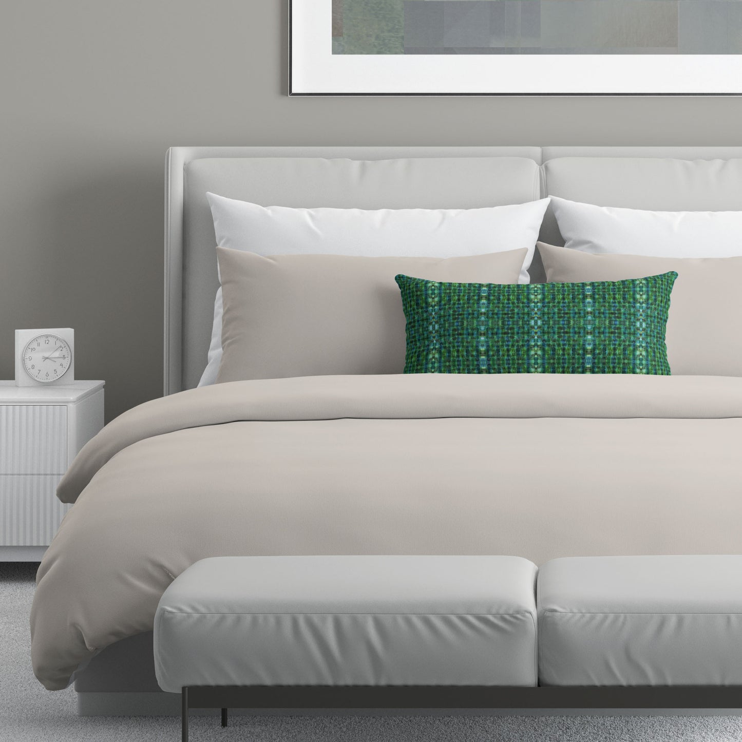 Neutral colored bedroom featuring a bed with a green abstract patterned lumbar pillow.