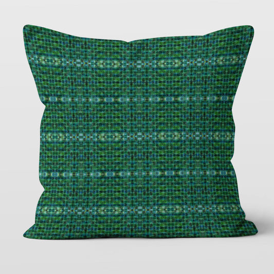Square pillow featuring a green plaid pattern 