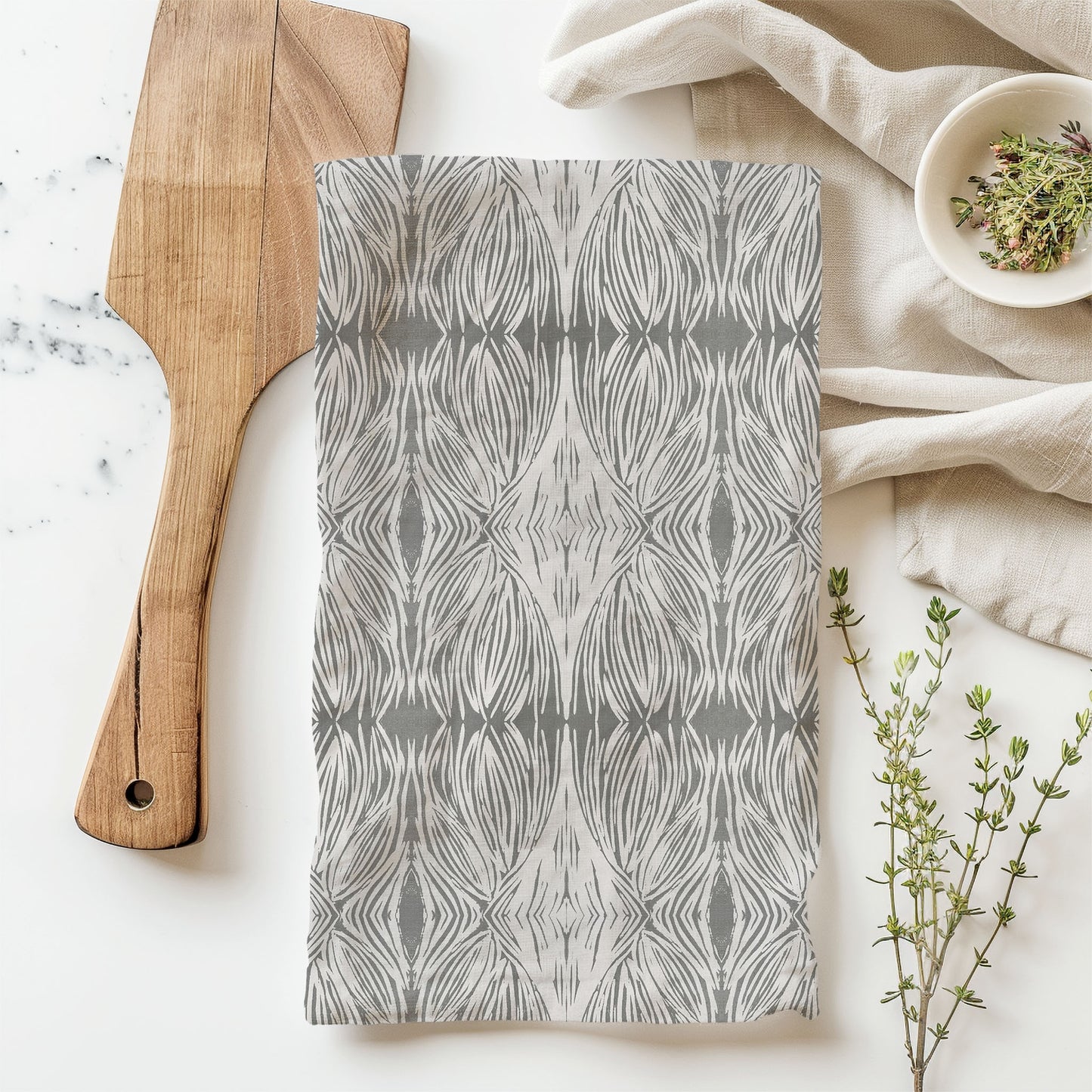 Flour sack tea towel featuring a gray and beige abstract pattern