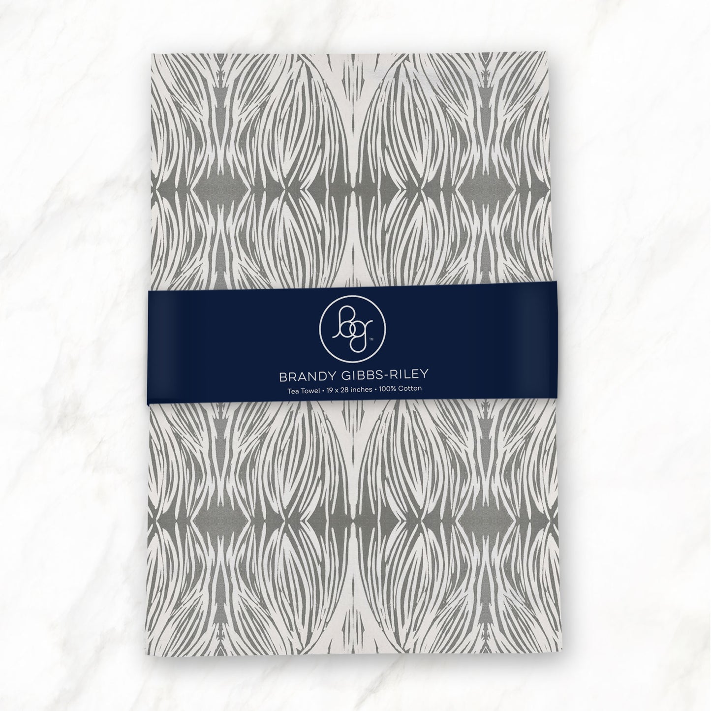 Flour sack tea towel featuring a gray and beige abstract pattern