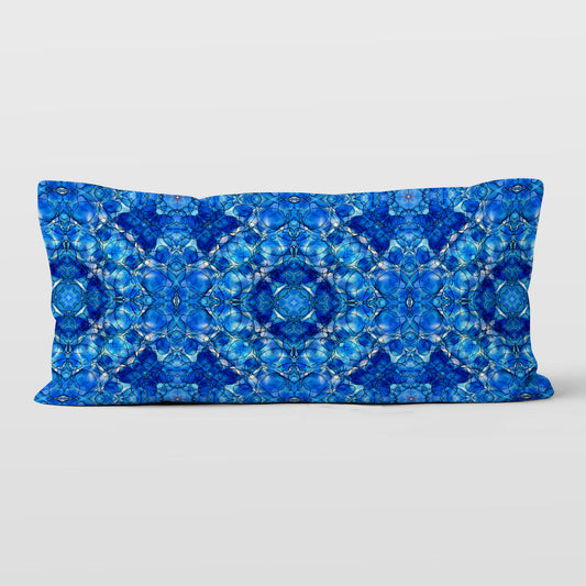 Rectangular lumbar pillow featuring a hand painted abstract pattern in cobalt blue.