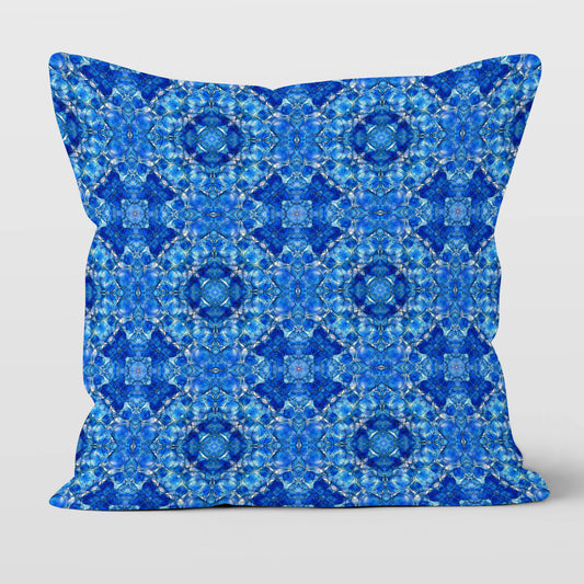 Square throw pillow featuring a hand-painted pattern mosaic pattern in cobalt blue.