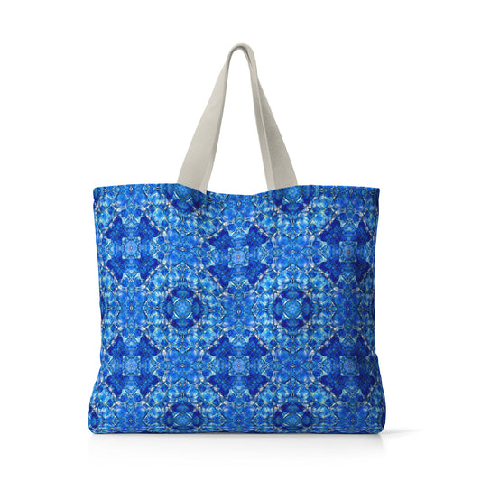 Bright blue tote bag featuring an abstract hand-painted pattern