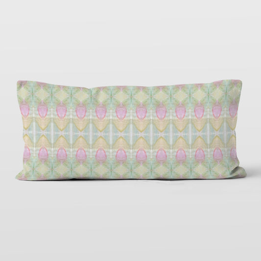 Rectangular pillow featuring a hand-painted abstract rosebud pattern.