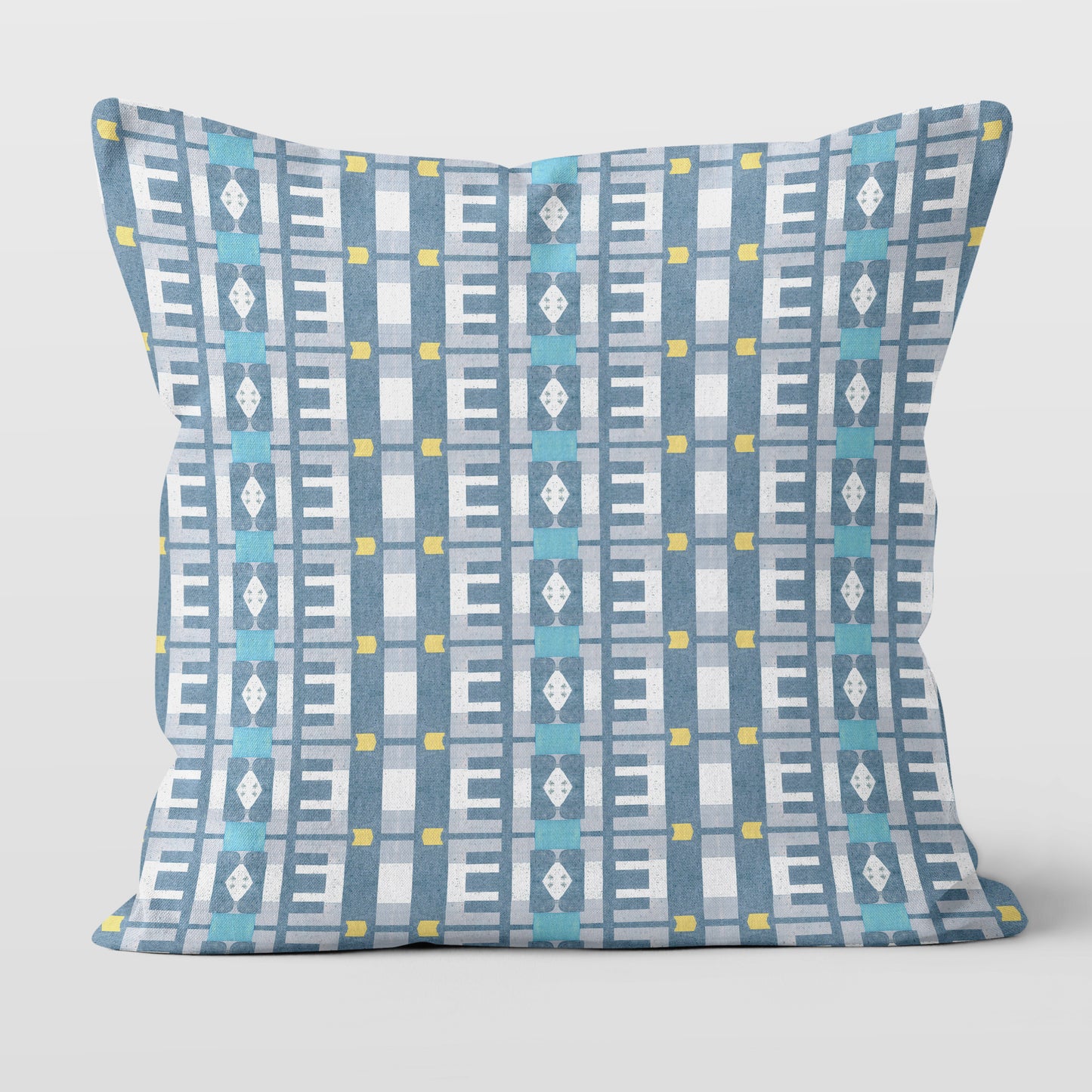 Throw pillow featuring a geometric blue and white pattern against a white background