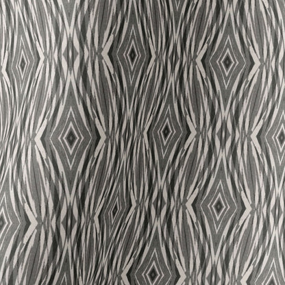 Detail of a linocut pattern in beige, gray, and black.