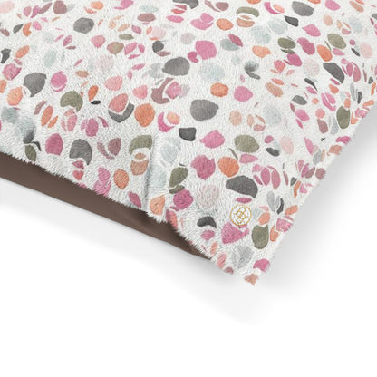 Fleece dog bed featuring an abstract floral pattern in shades of pink