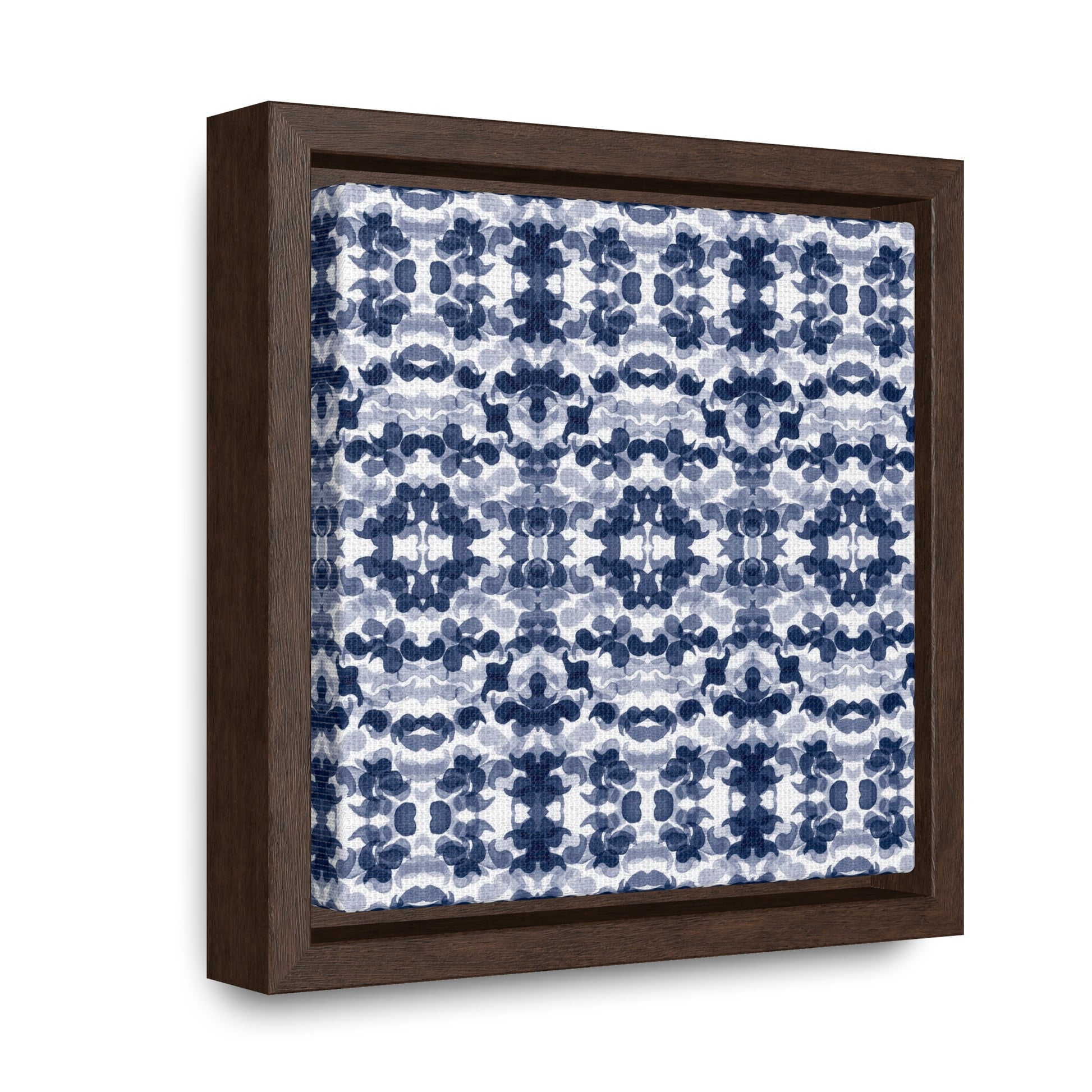 Smalled framed canvas featuring a navy blue paisley pattern