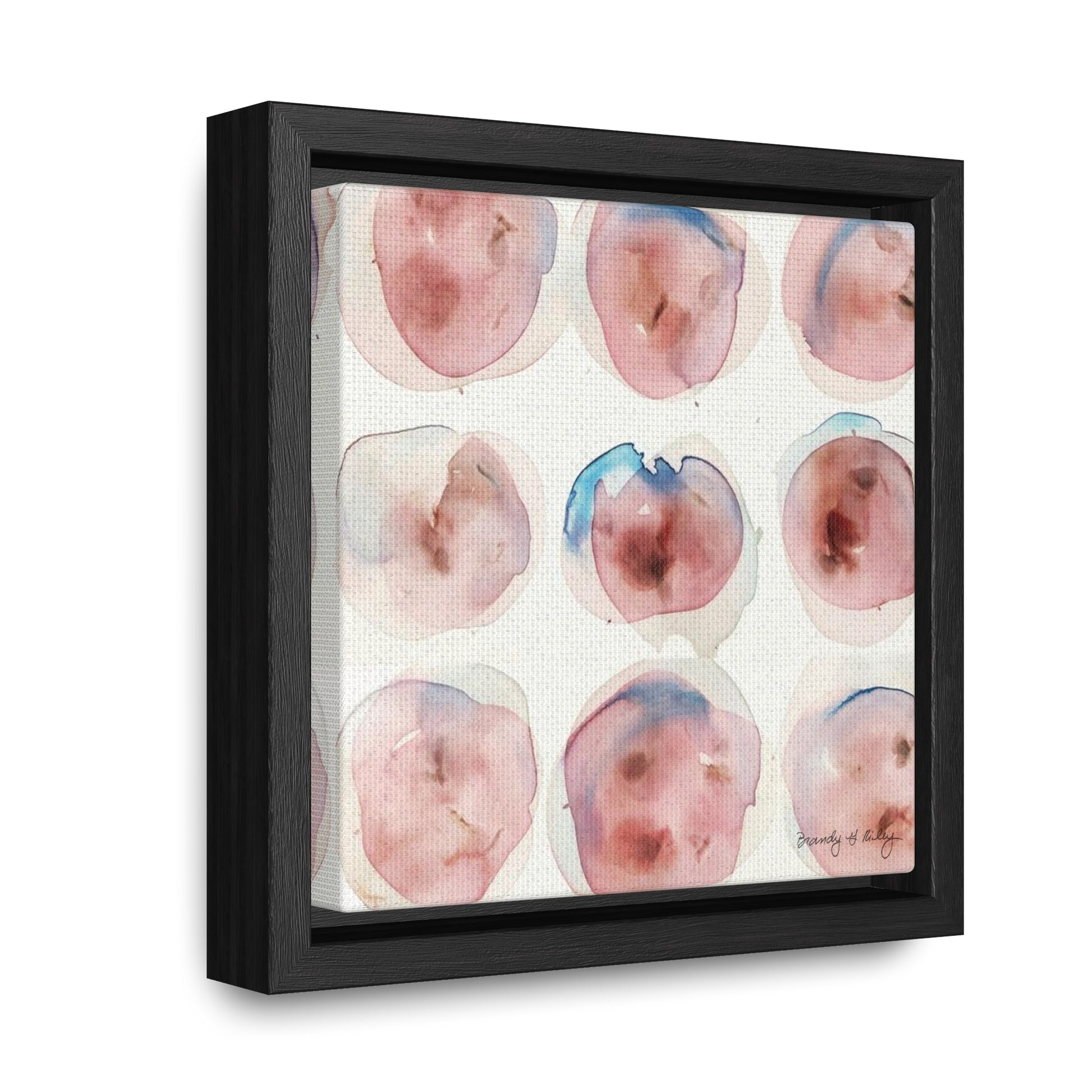 Abstract painting with pink and blue abstract circles in a black frame.