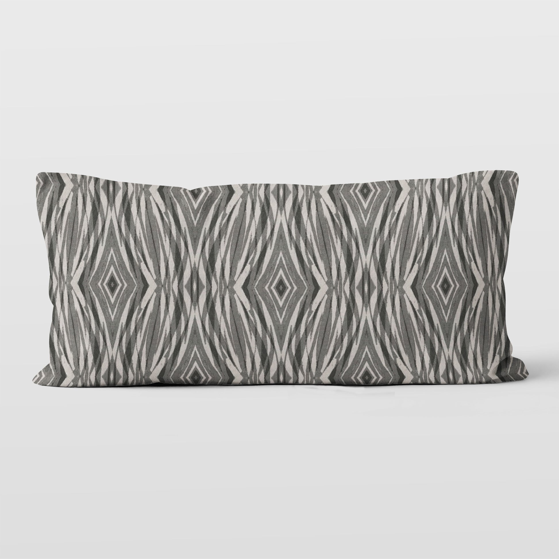 Rectangular lumbar pillow featuring linocut pattern in grey and neutral tones.