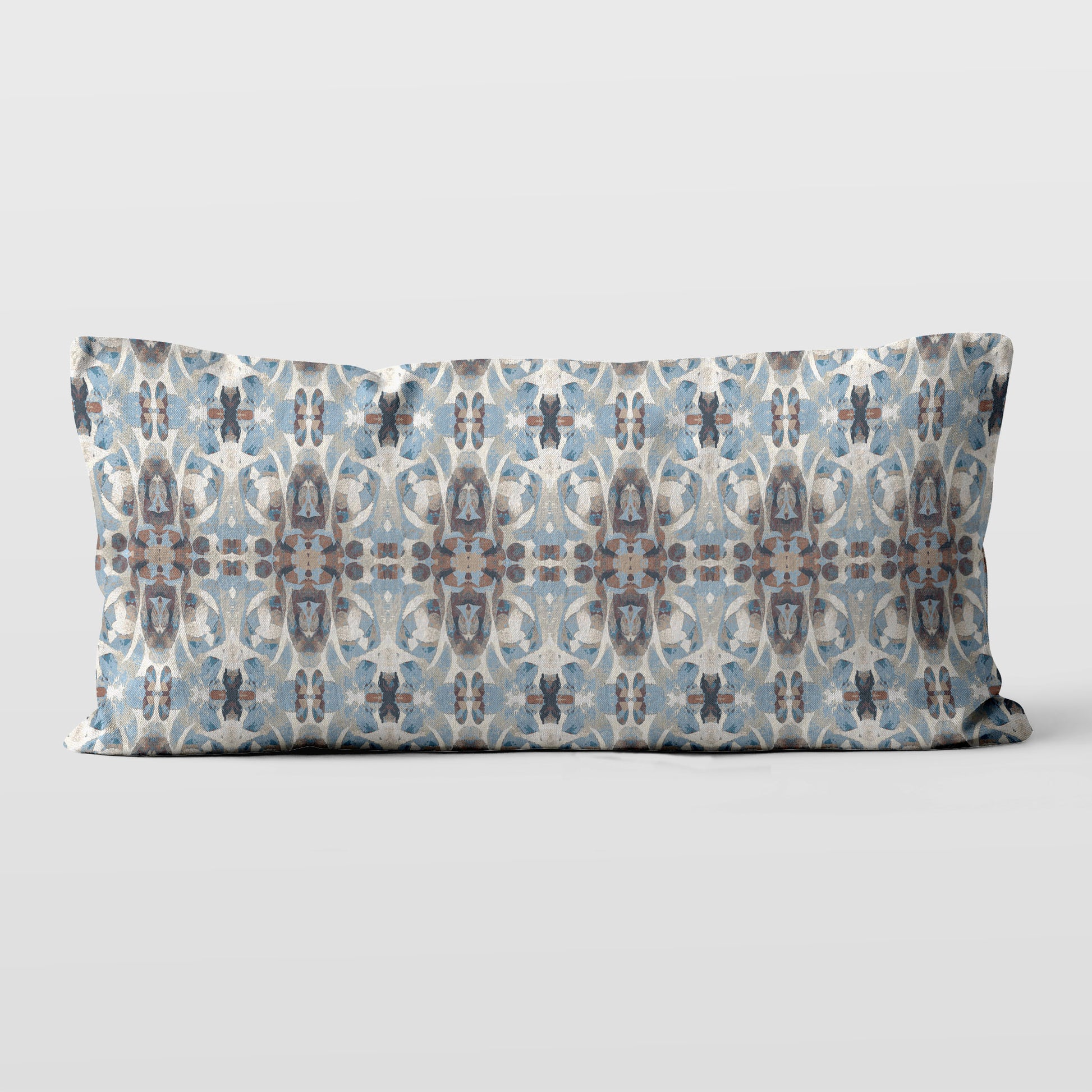 12 x 24 lumbar pillow featuring an abstract hand-painted blue and brown pattern.