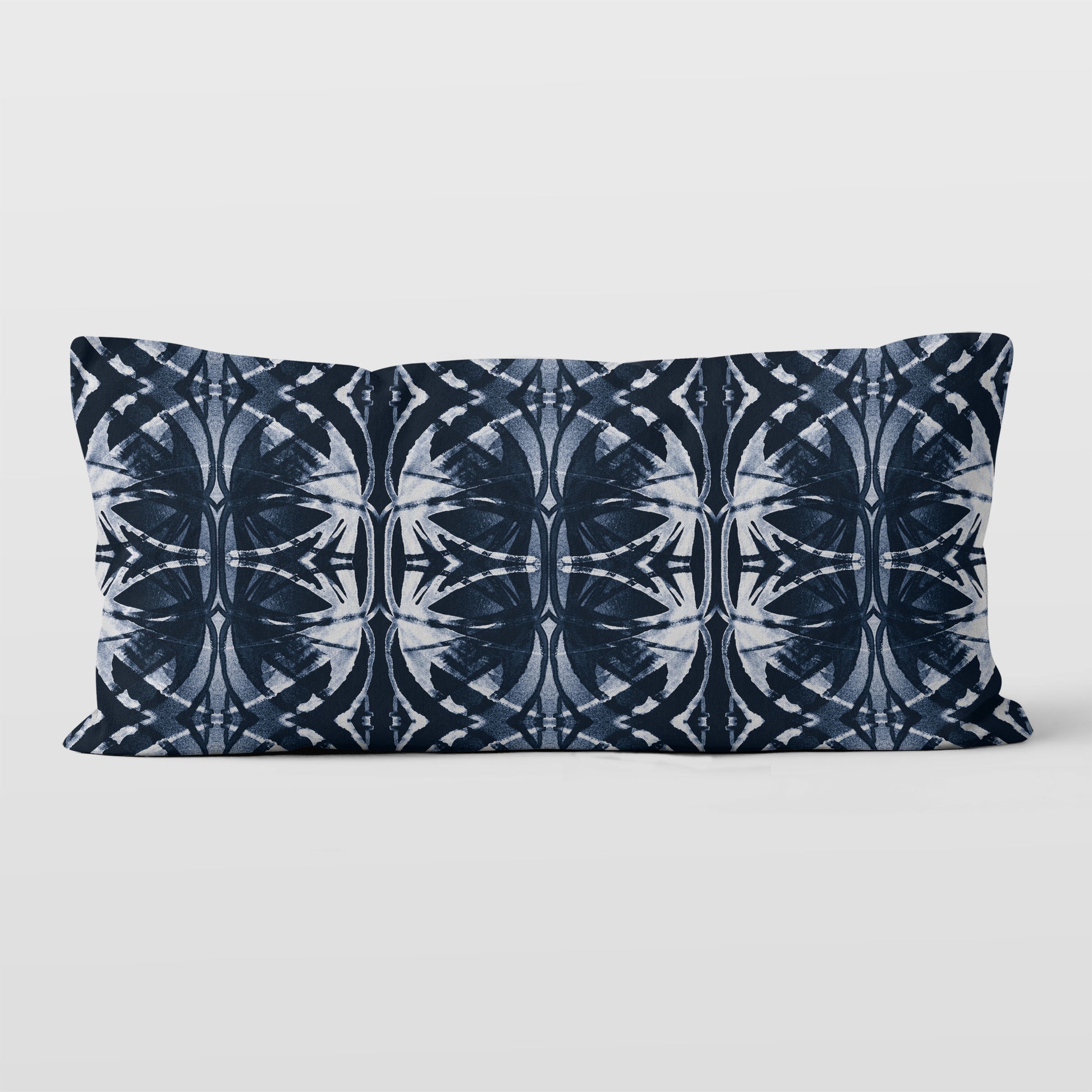 Rectangular pillow featuring abstract pattern in dark blue and white.