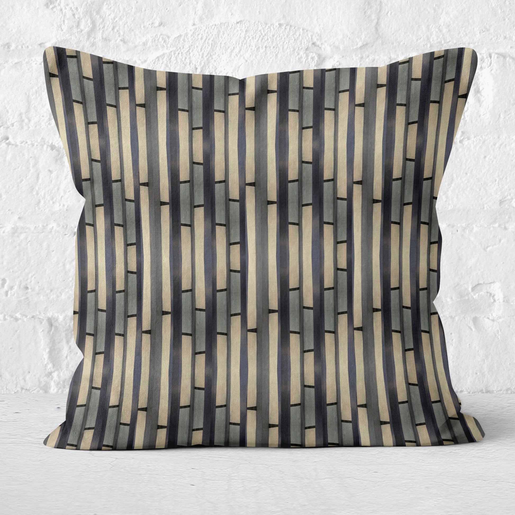 Abstract striped pillow on a white brick background