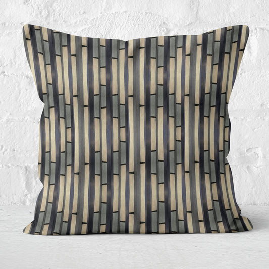 Abstract striped pillow on a white brick background