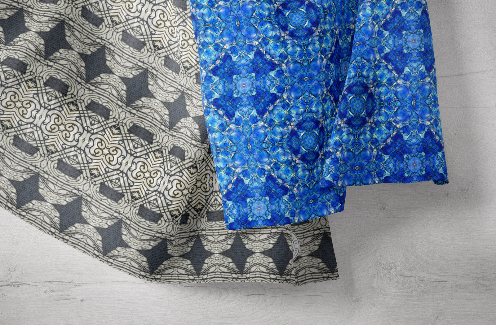 Close-up of tea towels featuring black and blue abstract patterns.