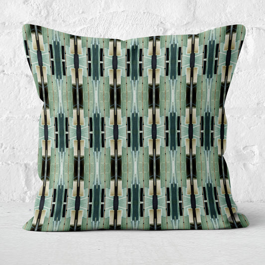 Throw pillow featuring an abstract geometric green pattern