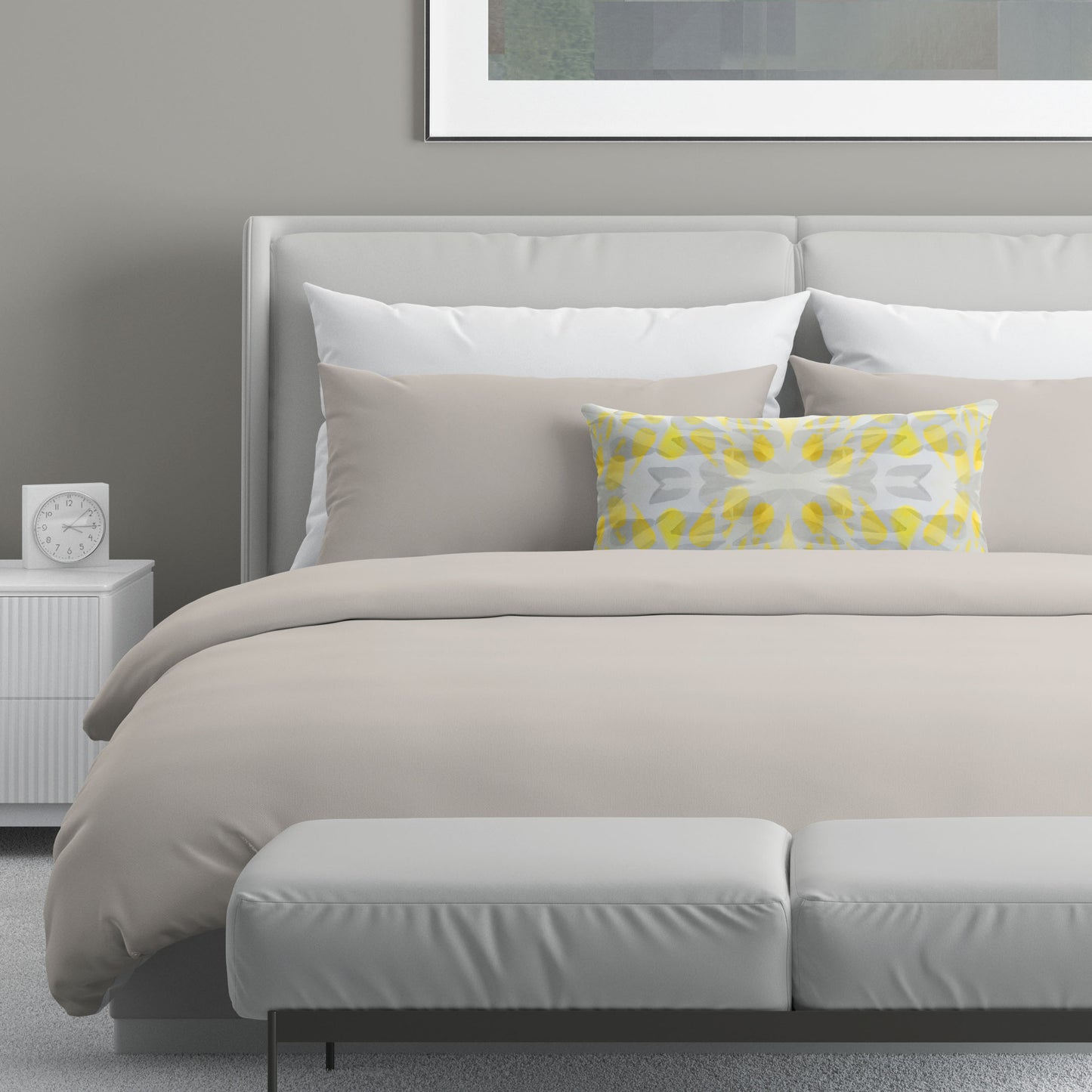 Neutral colored bedroom featuring a bed with an abstract yellow and gray patterned lumbar pillow.