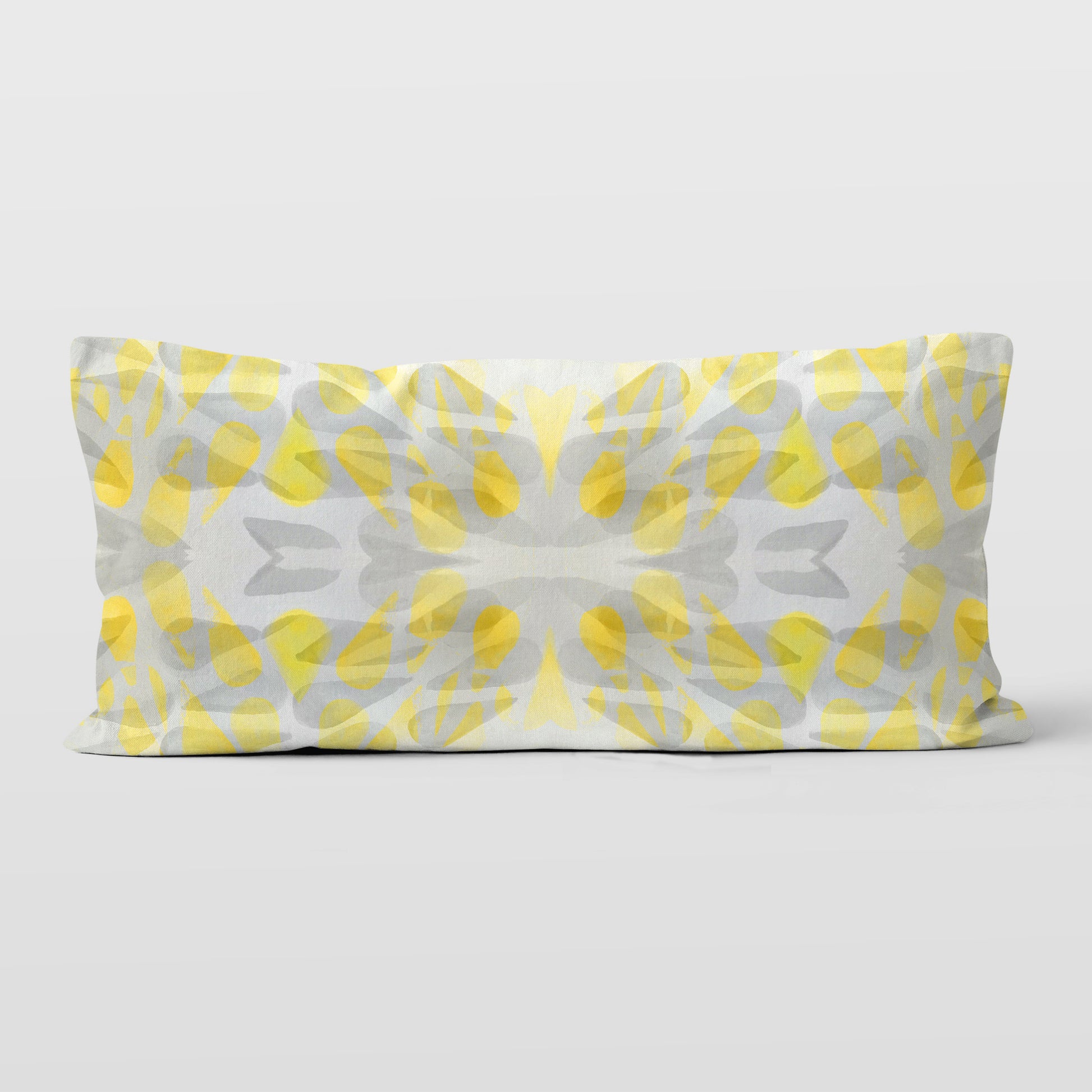 Rectangular lumbar pillow featuring an abstract hand-painted pattern in yellow and grey tones.