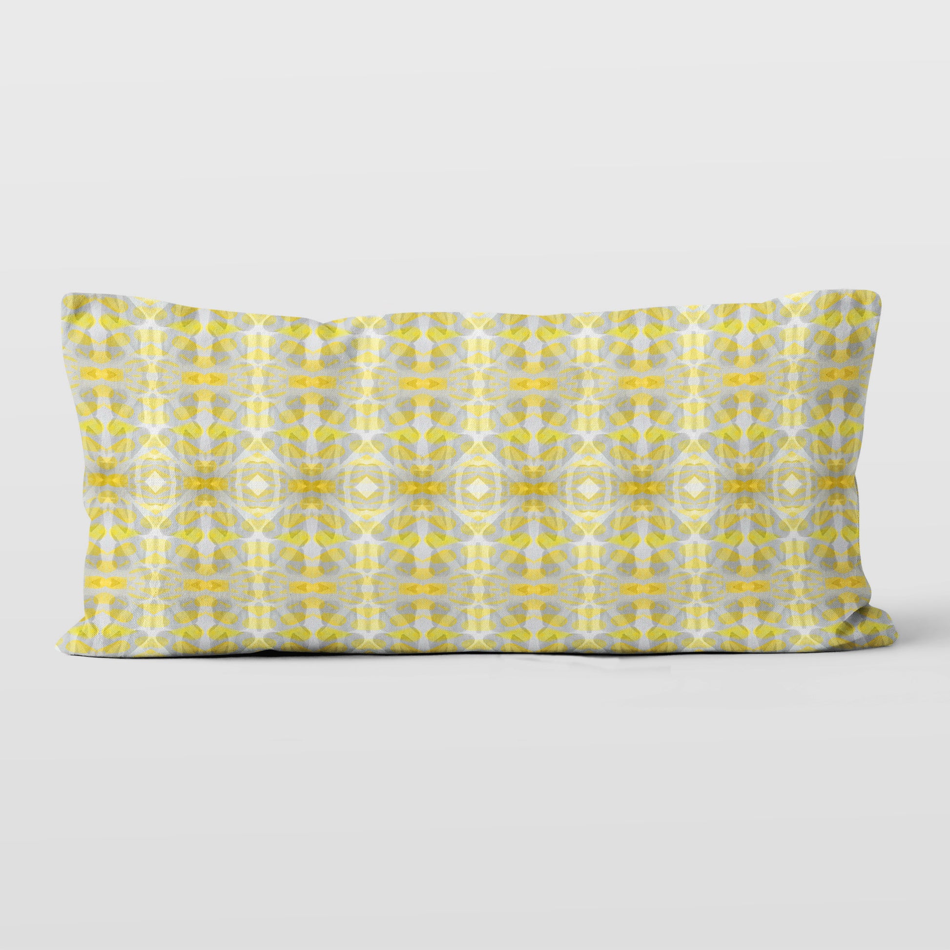 Rectangular lumbar pillow featuring handprinted striped yellow and grey pattern.
