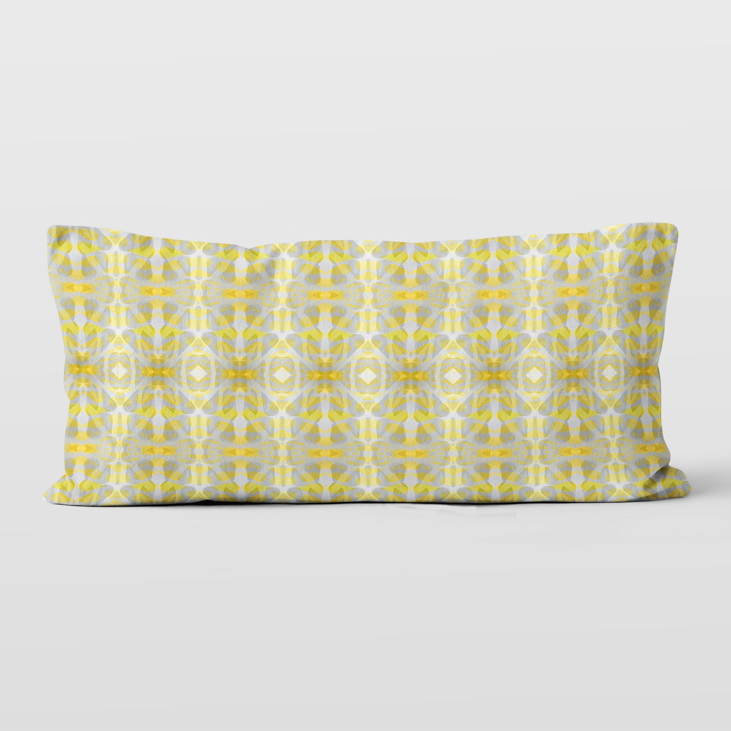 Rectangular lumbar pillow featuring handprinted striped yellow and grey pattern.