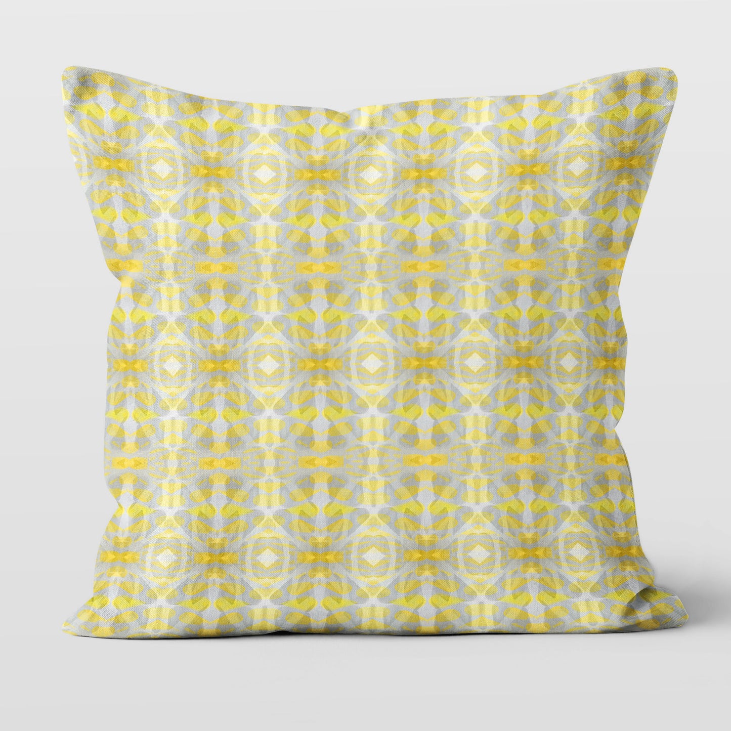 Square throw pillow featuring a yellow and gray abstract pattern