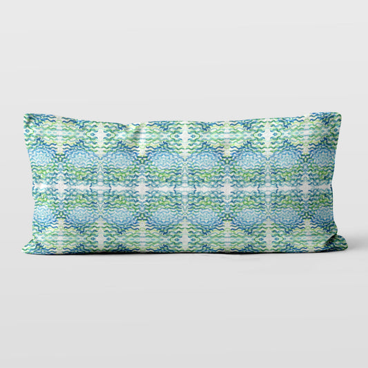 12x24 lumbar pillow featuring an abstract hand-painted pattern in green and blue.