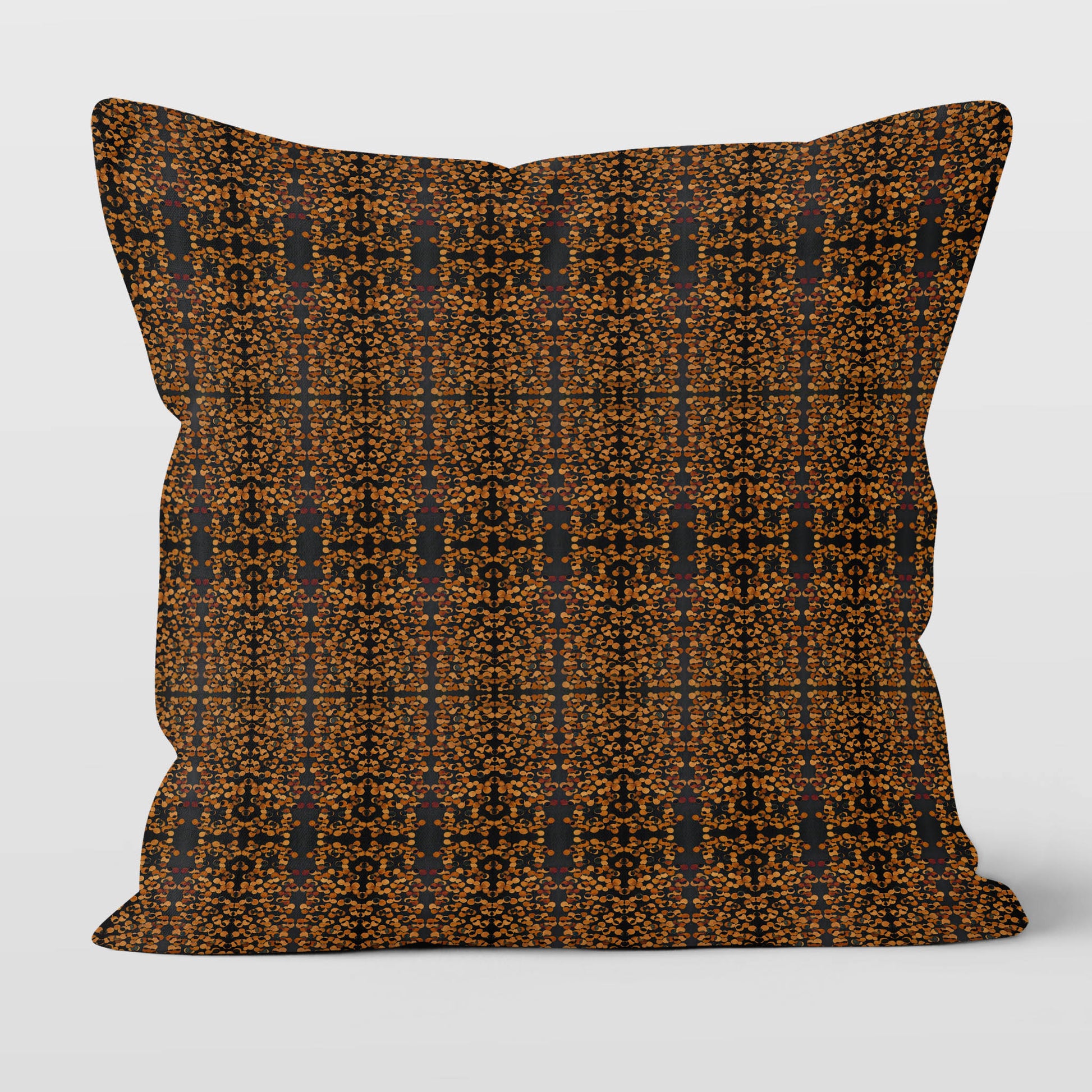 Square throw pillow featuring a hand-pattern in black and copper tones.