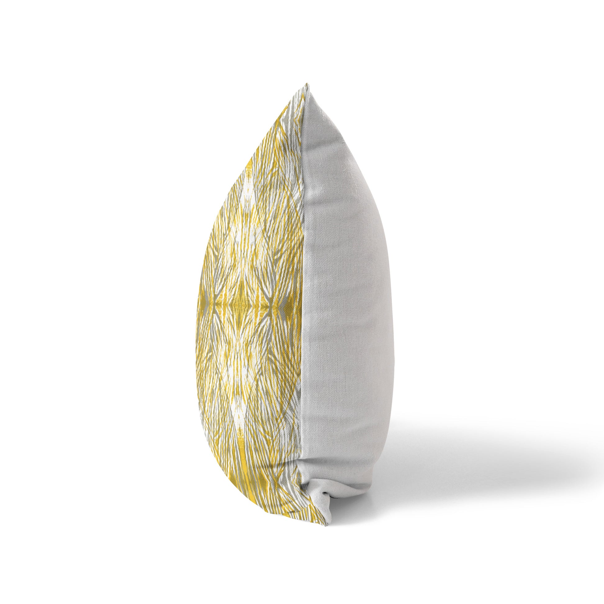 Side view of a pillow featuring an abstract gold and gray pattern and solid white back