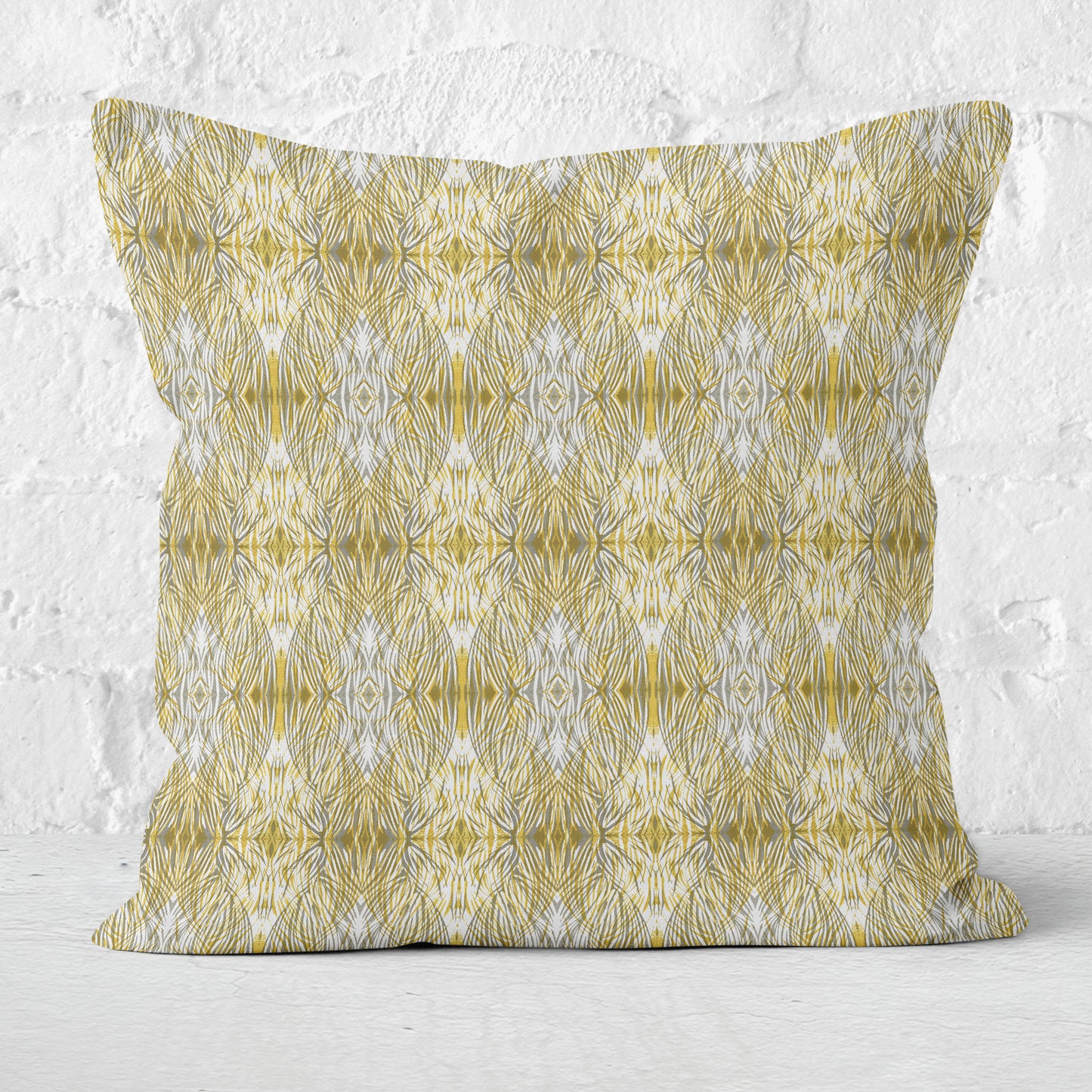 Throw pillow featuring linocut pattern in gold and gray.