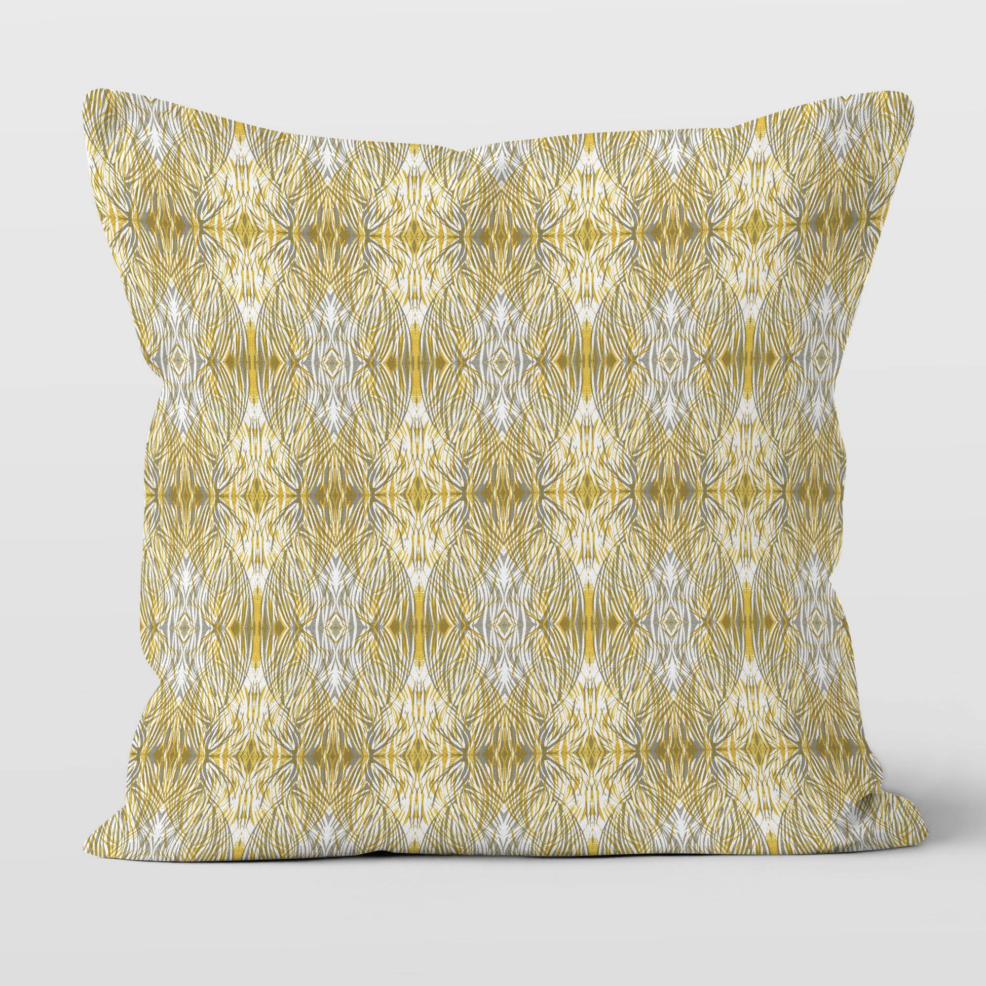 Throw pillow featuring linocut pattern in gold and gray.