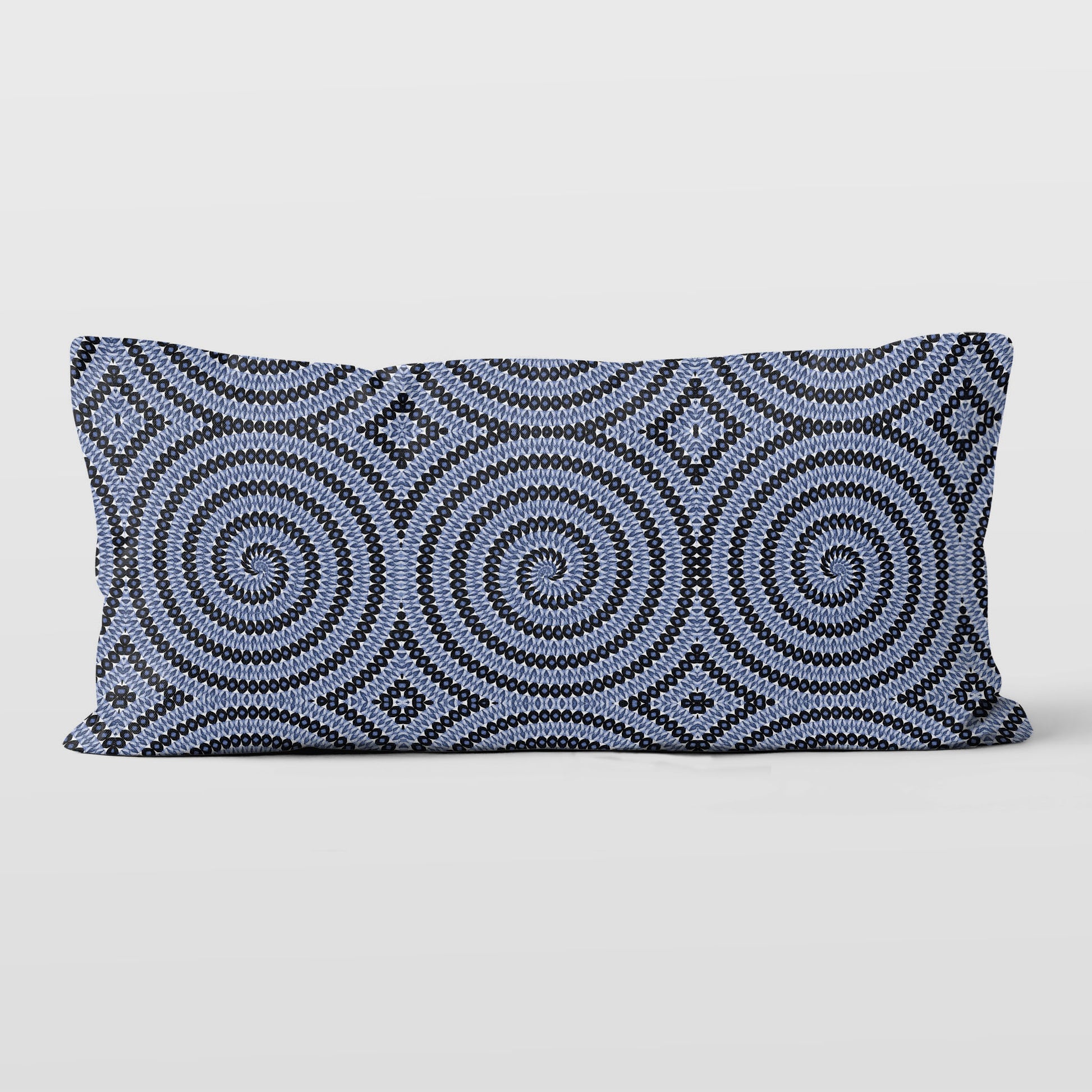 Rectangular lumbar pillow featuring hand-painted and collaged blue and white spiral pattern.