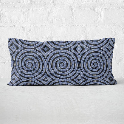 Rectangular lumbar pillow featuring hand-painted and collaged blue and white spiral pattern.