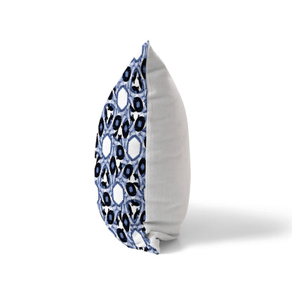 Side view of a pillow featuring an abstract blue pattern and solid white back