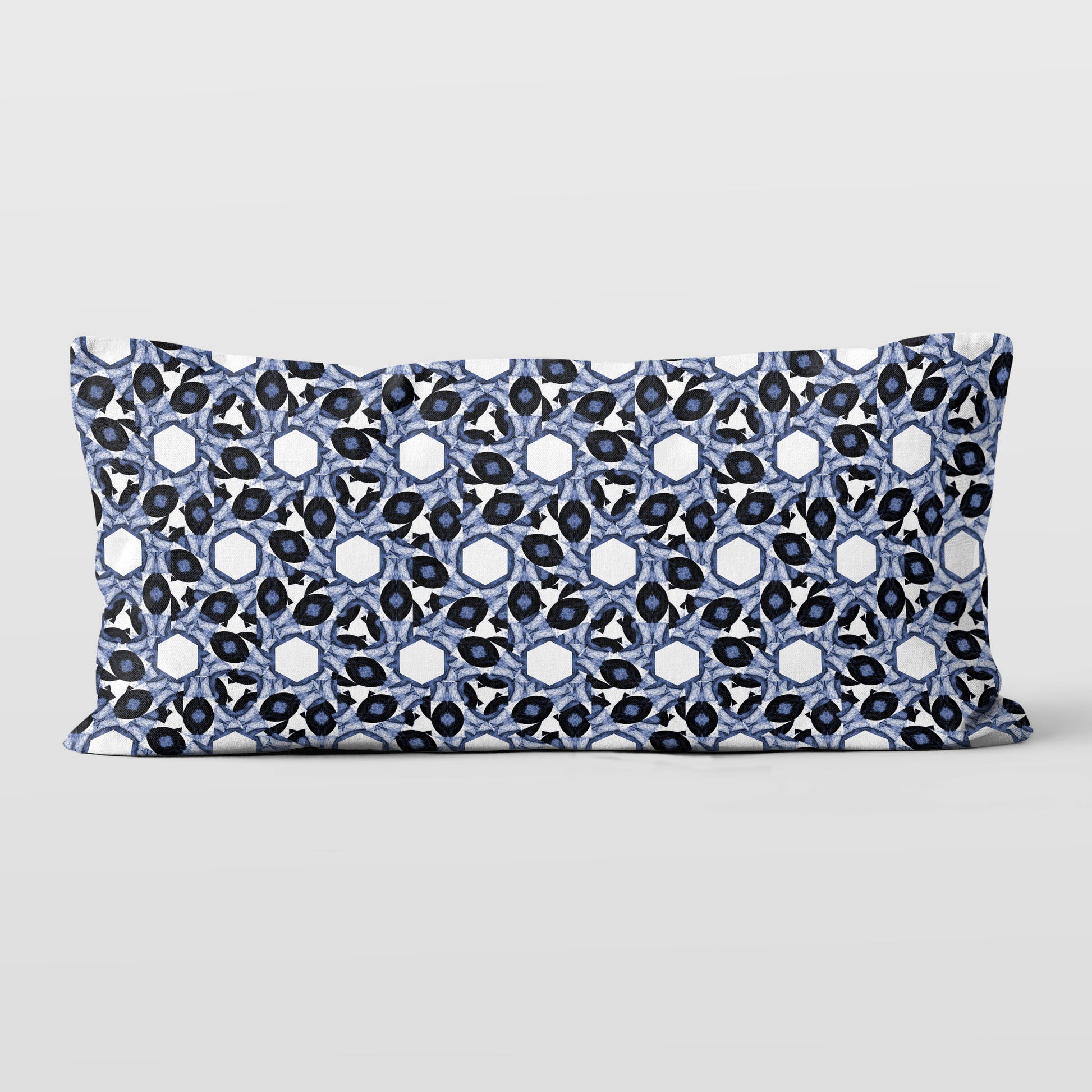 Rectangular lumbar pillow featuring abstract geometric pattern in blue and white.