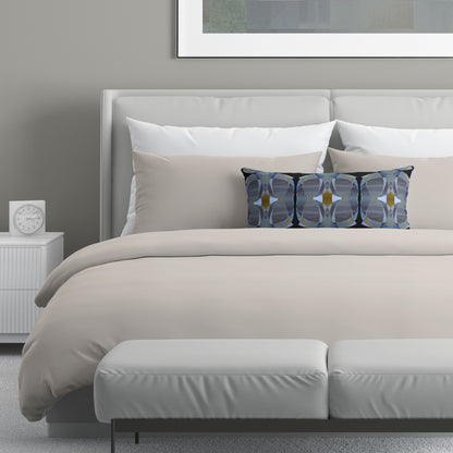Neutral colored bedroom featuring a bed with a black and gray abstract patterned lumbar pillow.