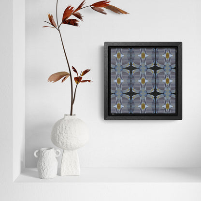 Mini stretch canvas featuring an abstract gray pattern in a black fraome, sitting in a white alcove