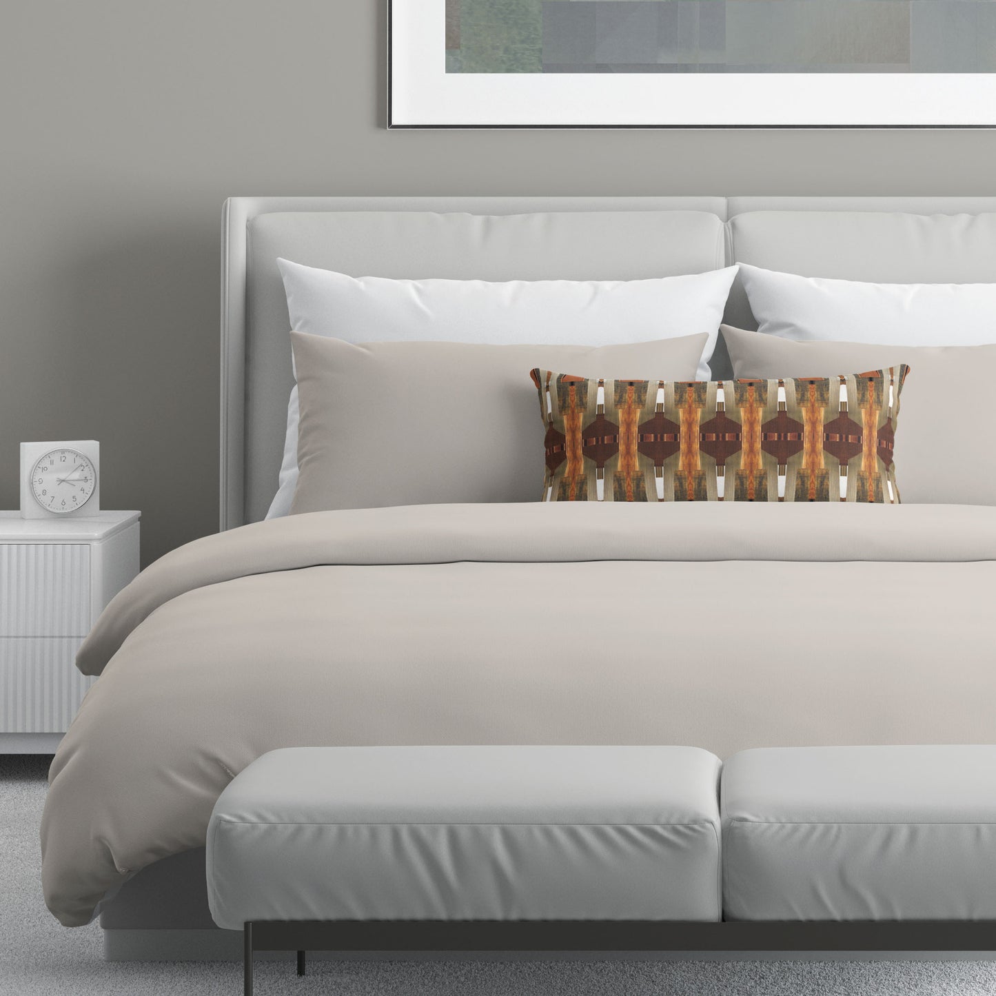 Neutral colored bedroom featuring a bed with an abstract brown patterned lumbar pillow.