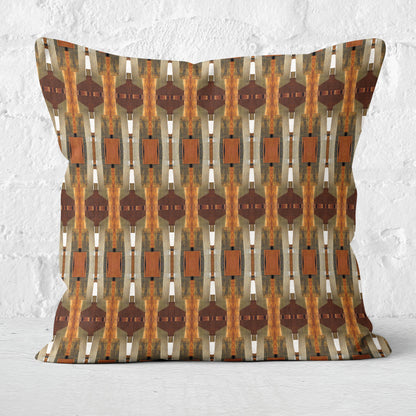 Throw pillow featuring collage pattern in wood and warm tones., standing against a white brick wall