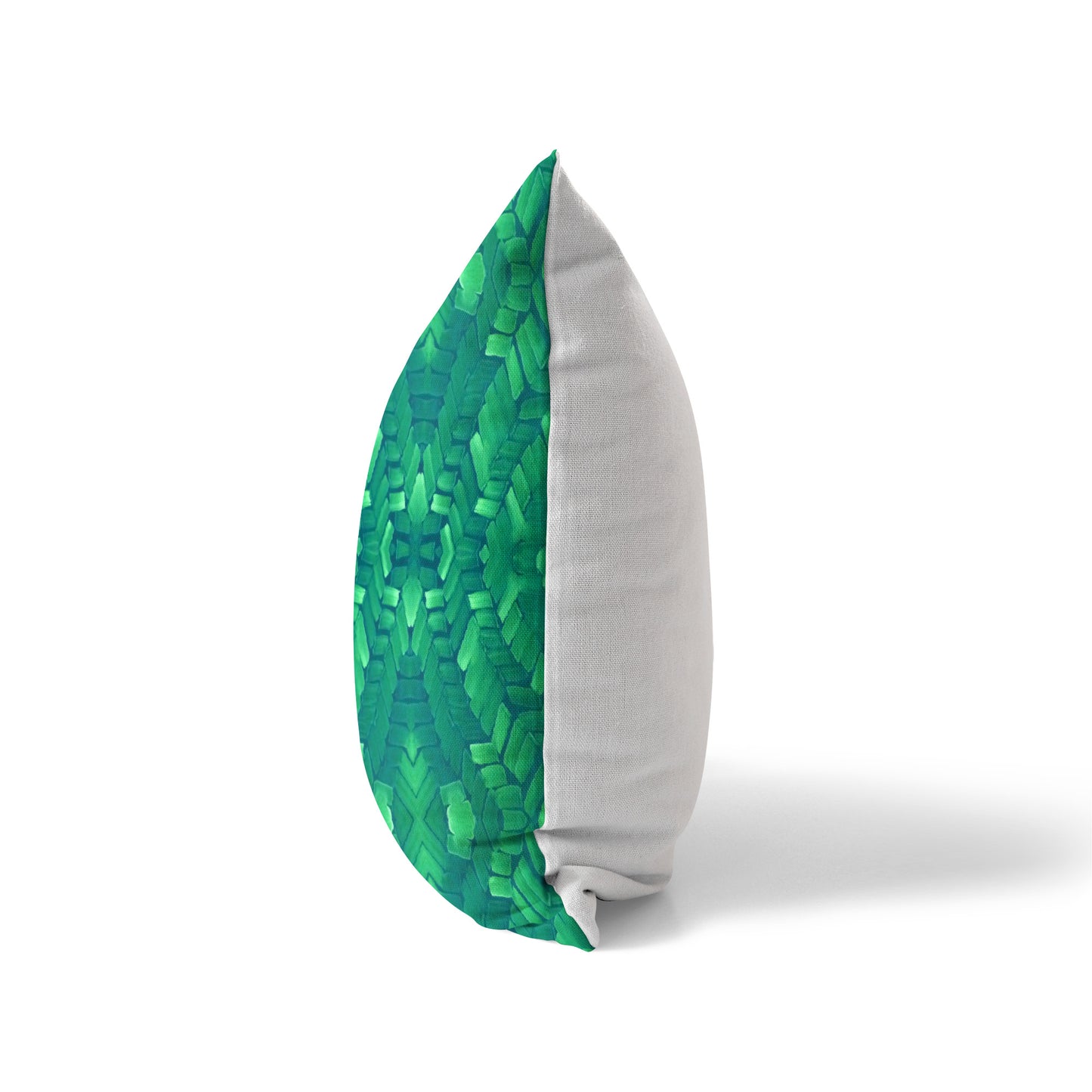 Side view of a pillow featuring a green abstract pattern and solid white back
