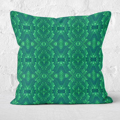 Pillow featuring bright green hand-painted pattern with a white brick wall in the background