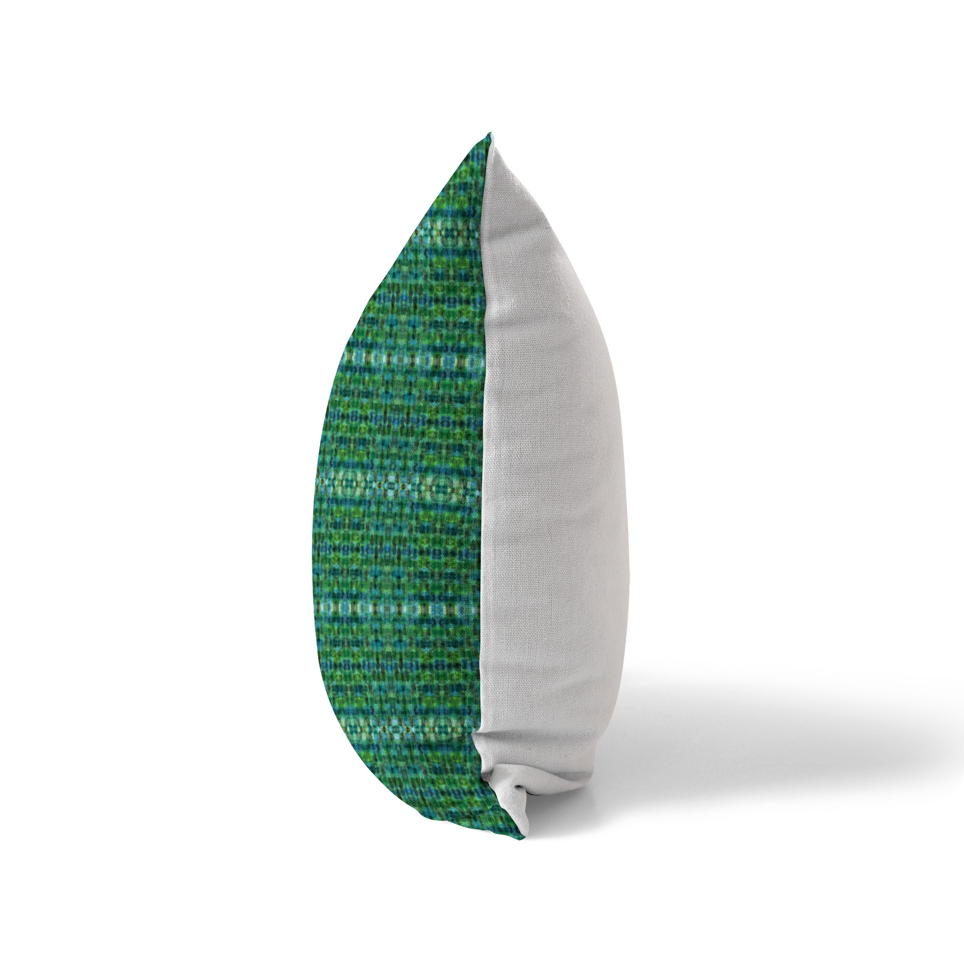 Side view of a pillow featuring a green plaid pattern and solid white back