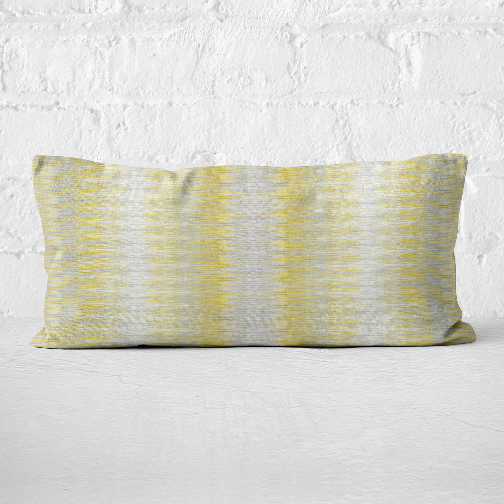 Striped pillow with yellow and gray pattern on a white background